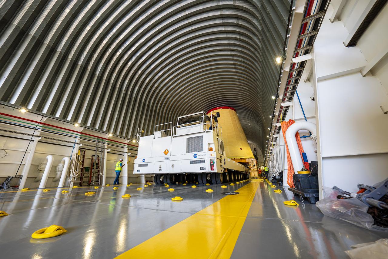 NASA rolled out a key piece of space flight hardware for the SLS (Space Launch System) rocket for the first crewed mission of NASA’s Artemis campaign from Marshall Space Flight Center in Huntsville, Alabama, on Wednesday, Aug. 21 for shipment to the agency’s spaceport in Florida. The cone-shaped launch vehicle stage adapter connects the rocket’s core stage to the upper stage and helps protect the upper stage’s engine that will help propel the Artemis II test flight around the Moon, slated for 2025. Manufactured by prime contractor Teledyne Brown Engineering and the Jacobs Space Exploration Group’s ESSCA (Engineering Services and Science Capability Augmentation) contract using NASA Marshall’s self-reacting friction-stir robotic and vertical weld tools. Crews moved the adapter out of NASA Marshall’s Building 4708 to the agency’s Pegasus barge Aug. 21. The barge will ferry the adapter first to NASA’s Michoud Assembly Facility in New Orleans, where crews will pick up additional SLS hardware for future Artemis missions, before traveling to NASA Kennedy. Once in Florida, the adapter will join the recently delivered core stage. There, teams with NASA’s Exploration Ground Systems will prepare the adapter for stacking and launch.